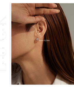 Close-up of 6mm rose-cut zircon stud earring on ear with minimalist silver setting