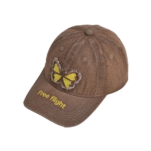 Detail of butterfly patch and Free flight embroidery on washed cotton baseball cap