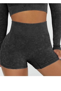 Detail of high waist charcoal grey ribbed yoga shorts showing texture and stretch fit