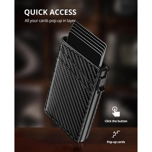 Detail view of carbon fiber wallet showing the quick access card pop-up mechanism and texture