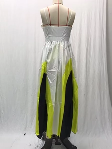 Detail of color-block pleated maxi dress with white, yellow and black geometric patterns