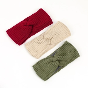 Detailed knit texture of red, cream and olive green winter thermal headbands