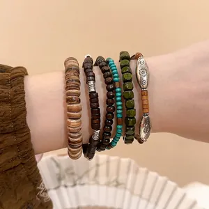 Bohemian six-piece set of irregular wooden beads and coconut shell bracelets on a wrist