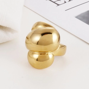 Detailed view of chunky gold-plated stainless steel ring with stacked puff design