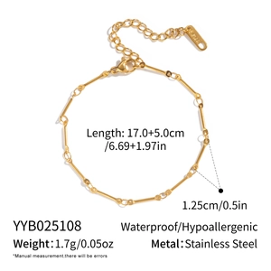 Macro detail of 18K gold plated stainless steel bone link necklace with lobster clasp