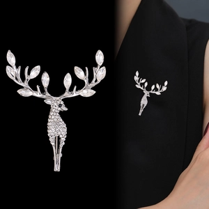 Detail view of silver deer brooch with sparkling rhinestones pinned on a black suit lapel