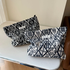 Artistic linen embroidery makeup bags featuring floral patterns with simple wish label
