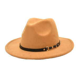 Close-up of camel wool fedora hat featuring a black leather band with a golden metal buckle