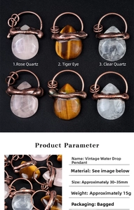 Detailed view of handmade teardrop gemstone pendants wrapped in antique bronze wire finish