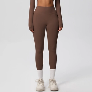 Women's brown high-waisted yoga pants and long sleeve sports top set in solid color
