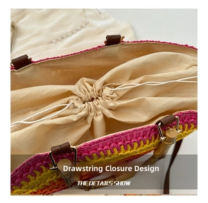 Macro view of woven straw beach bag featuring a secure beige drawstring closure