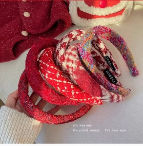Detailed view of assorted red tweed headbands with thick woven texture for the New Year