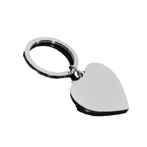 Polished silver heart shaped stainless steel keychain accessory for men on white background