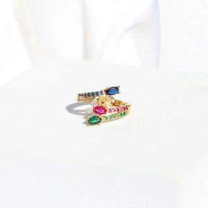 Detail of golden multi-layer open ring with colorful oval stones and zircons