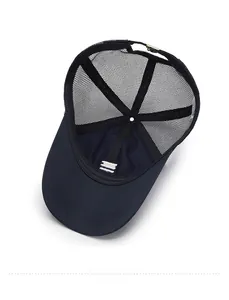 Detail view of the breathable mesh interior and adjustable metal buckle on dark blue cap