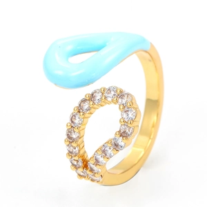 Detail of 18K gold ring with light blue enamel and micro-set zirconia on open band