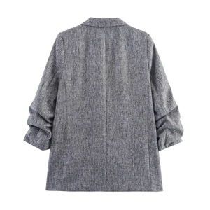 Back view of grey casual blazer with pleated sleeves and textured tweed fabric blend