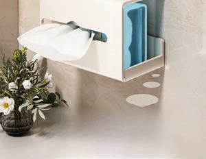 Wall-mounted cream white tissue box shelf showing facial towel and skincare storage detail