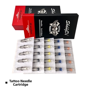 Detail view of tattoo cartridge needles in sterile packaging with color-coded ends