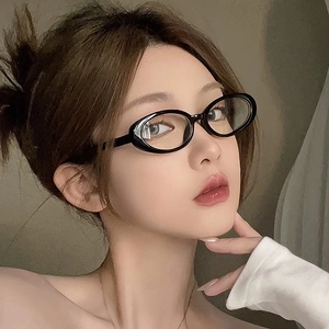 Asian model wearing vintage black oval glasses with a polished frame and minimalist style