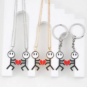 Magnetic stick figure couple necklace and keychain set with matching red enamel hearts