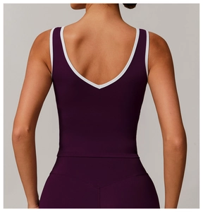 Detail of the back U-shaped design with contrast white trim on a purple yoga vest