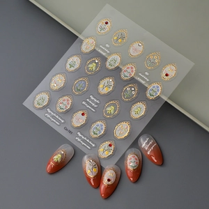 Macro detail of 5D embossed nail stickers Co-161 with gold frames and floral designs