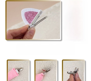 Detail of plush cat ear hair clips with glitter finish and adjustable metal clip design