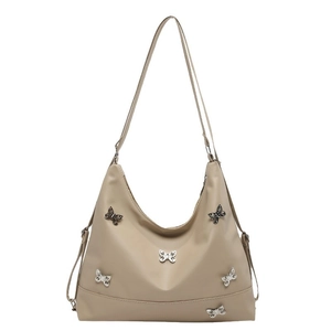 Minimalist beige shoulder bag with decorative silver metal butterflies and top zipper