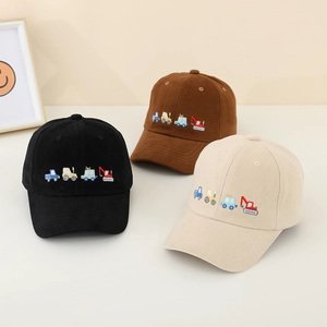 Close-up of children's cotton baseball caps with colorful excavator embroidery detail