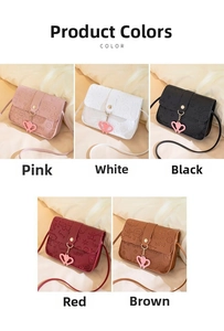 Close-up of small crossbody bags featuring embossed letters and heart-shaped charms