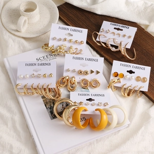 6-piece gold geometric earring set with pearls and resin charms on display card