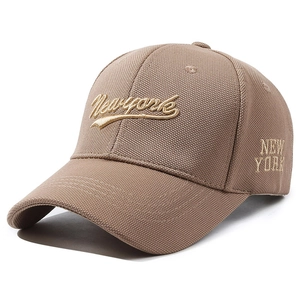 Brown baseball cap with Newyork embroidery and fine textured fabric on white background
