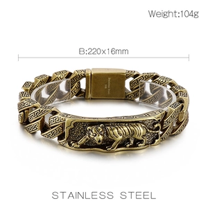 Detail of vintage gold tiger head bracelet in stainless steel with 104g weight mark