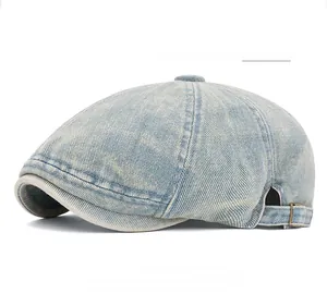Detail view of vintage light blue washed denim beret featuring adjustable metal buckle