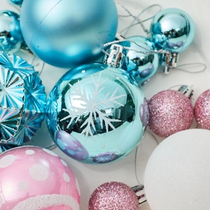 Set of blue and pink Christmas balls with snowflake and dot patterns for tree decoration