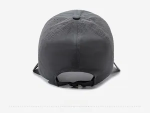 Detail of grey sun hat showing breathable laser-cut vents and adjustable back strap