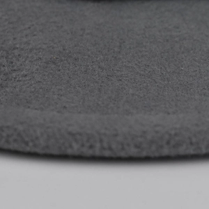 Detailed close-up showing the dense needle-punched fiber texture of dark grey wool felt hat