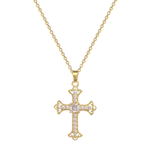 Elegant gold titanium cross necklace with sparkling clear crystals on white background