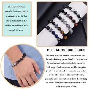 Detailed view of elastic men's bracelets with natural stone beads and metal cross charm