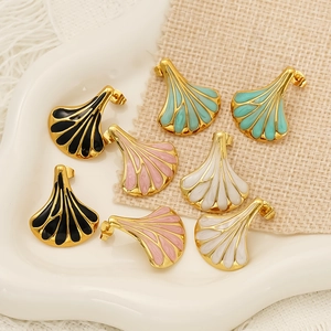 Golden fan-shaped fan-shaped drop oil stud earrings in four elegant colors set on a tray
