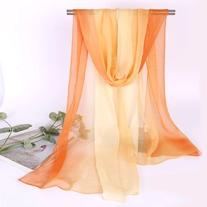 Detailed texture of lightweight gradient orange and yellow long chiffon sun protection scarf