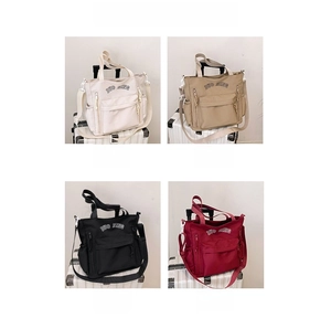 Detail of multi-color nylon tote bags showing pockets and adjustable straps in four colors