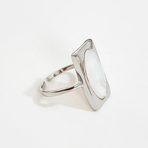 Minimalist S925 sterling silver ring featuring an oval white shell on an adjustable band