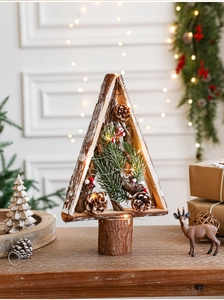 Detail of wooden triangle Christmas tree with pine cones, red berries and LED lights