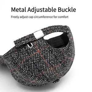 Dark grey tweed plaid baseball cap with adjustable metal buckle and woven texture