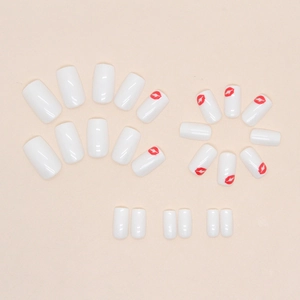 Square press-on nails in white and red color block with heart lip print patterns