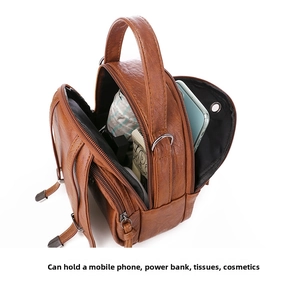 Brown vintage leather cross-body bag showing multiple zipper compartments and storage capacity
