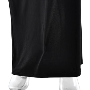 Detail shot of the black summer dress hem showing fine stitching and draped fabric texture