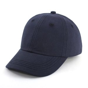 Detail view of a navy blue cotton kids baseball cap with a classic curved brim design